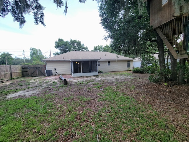 6868 E Bay Blvd, Navarre, FL 32566 - back of house with a sunroom and a gate