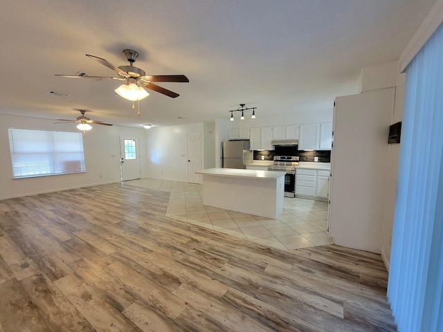 6868 E Bay Blvd, Navarre, FL 32566 - unfurnished living room featuring light wood-style floors, ceiling fan, and track lighting