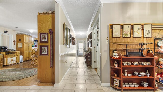 4936 Grassy Pond Rd, Chipley, FL 32428 - corridor featuring light tile patterned flooring, ornamental molding, and a textured ceiling