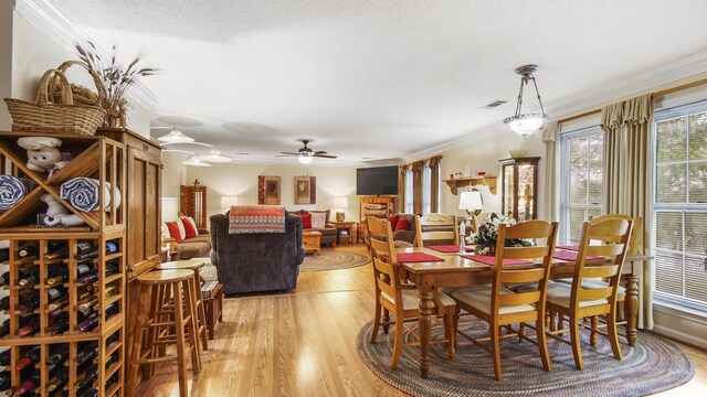 4936 Grassy Pond Rd, Chipley, FL 32428 - dining area featuring light wood-style floors, ornamental molding, and ceiling fan