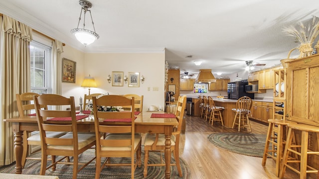 4936 Grassy Pond Rd, Chipley, FL 32428 - dining room featuring light wood-style floors, a ceiling fan, and crown molding