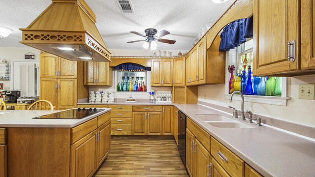 4936 Grassy Pond Rd, Chipley, FL 32428 - kitchen featuring custom range hood, black electric stovetop, a textured ceiling, ceiling fan, and light wood finished floors