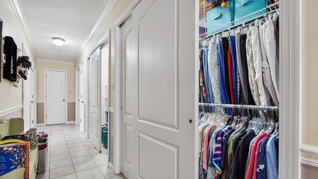 4936 Grassy Pond Rd, Chipley, FL 32428 - hallway with ornamental molding, light tile patterned floors, and a textured ceiling