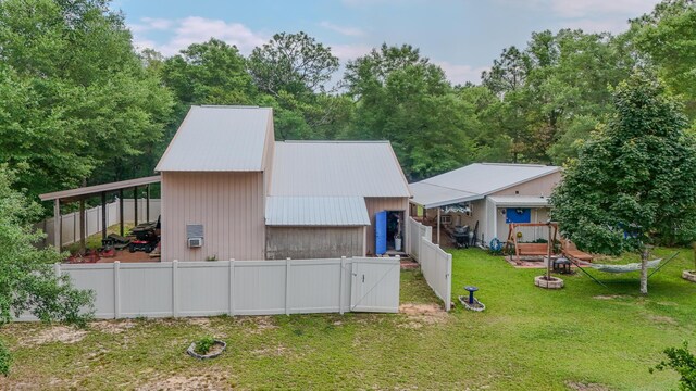 4936 Grassy Pond Rd, Chipley, FL 32428 - view of front of house with a fenced backyard and a metal roof
