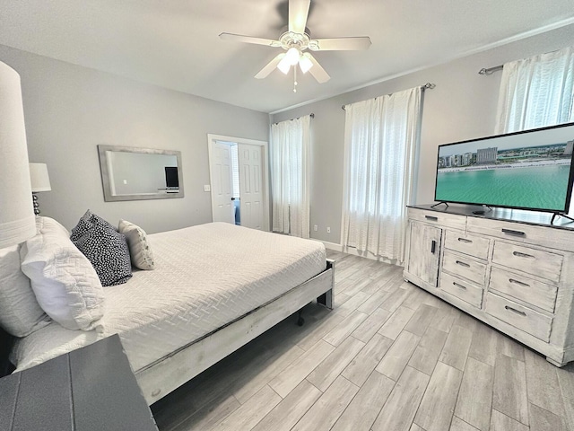 83 Sunfish St, Destin, FL 32541 - bedroom with light wood-style flooring and ceiling fan