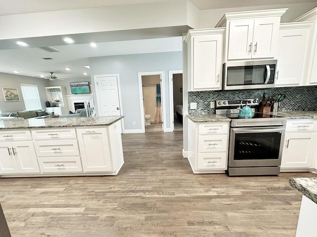 83 Sunfish St, Destin, FL 32541 - kitchen featuring stainless steel appliances, a ceiling fan, open floor plan, white cabinets, and recessed lighting