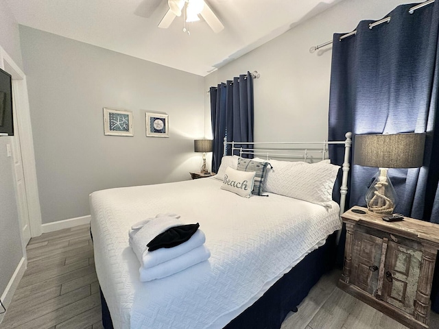 83 Sunfish St, Destin, FL 32541 - bedroom with wood finished floors, a ceiling fan, and vaulted ceiling