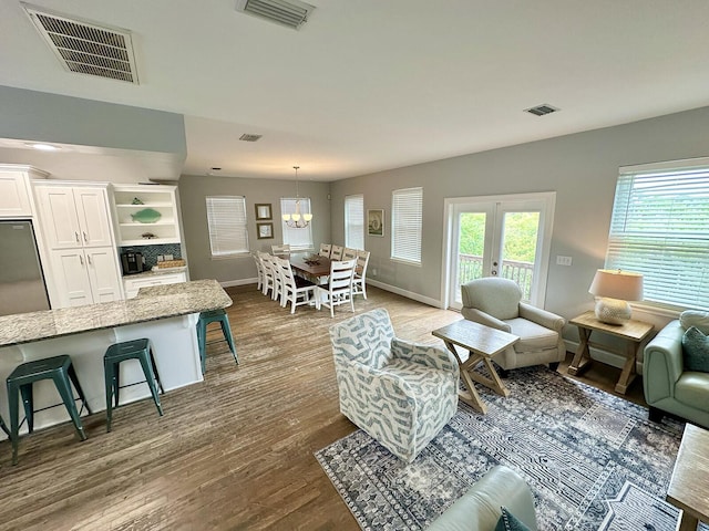83 Sunfish St, Destin, FL 32541 - living area with dark wood-type flooring and a chandelier