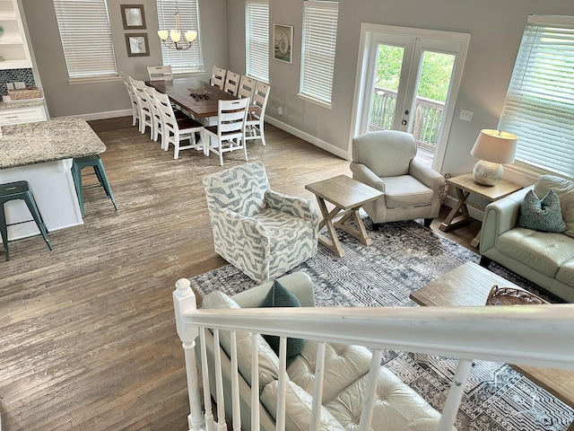 83 Sunfish St, Destin, FL 32541 - living area featuring a chandelier, wood finished floors, and french doors