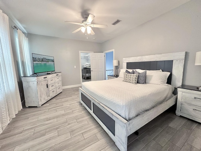 83 Sunfish St, Destin, FL 32541 - bedroom featuring light wood-style flooring, ceiling fan, and a walk in closet