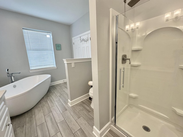 83 Sunfish St, Destin, FL 32541 - bathroom featuring a stall shower, a soaking tub, and wood finish floors