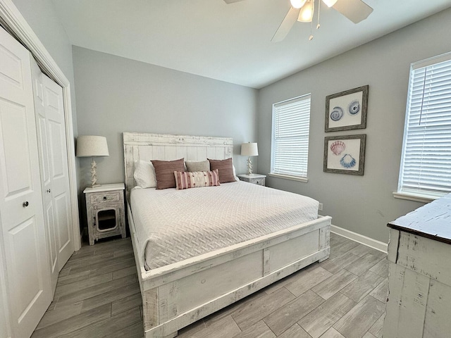 83 Sunfish St, Destin, FL 32541 - bedroom featuring light wood-type flooring, multiple windows, a closet, and a ceiling fan