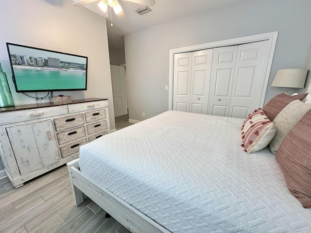 83 Sunfish St, Destin, FL 32541 - bedroom with light wood-type flooring, a closet, and ceiling fan