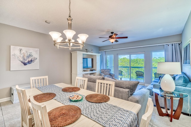 515 Tops L Beach Blvd # 301, Miramar Beach, FL 32550 - dining space with a ceiling fan, a chandelier, and light tile patterned flooring