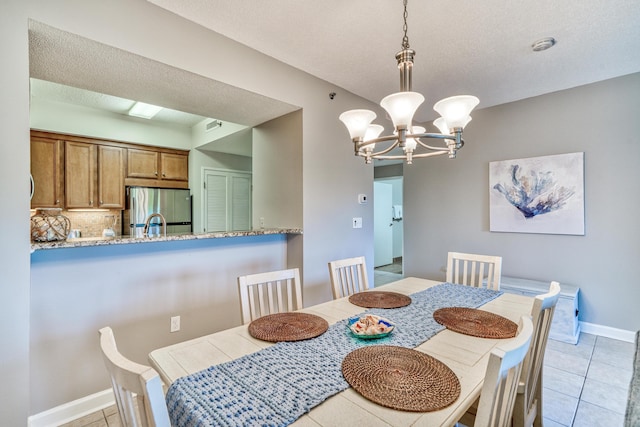 515 Tops L Beach Blvd # 301, Miramar Beach, FL 32550 - dining space featuring a chandelier and light tile patterned floors