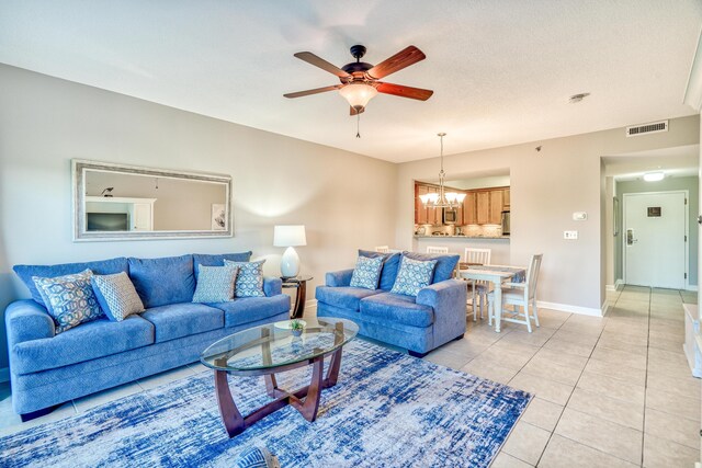 515 Tops L Beach Blvd # 301, Miramar Beach, FL 32550 - living room featuring a ceiling fan, a chandelier, and light tile patterned floors