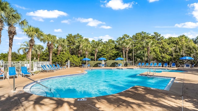 515 Tops L Beach Blvd # 301, Miramar Beach, FL 32550 - community pool featuring a patio and view of scattered trees