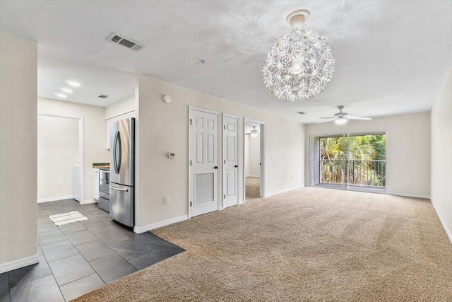 4276 Calinda Ln Apt 138, Niceville, FL 32578 - unfurnished living room with dark colored carpet, a ceiling fan, and a chandelier