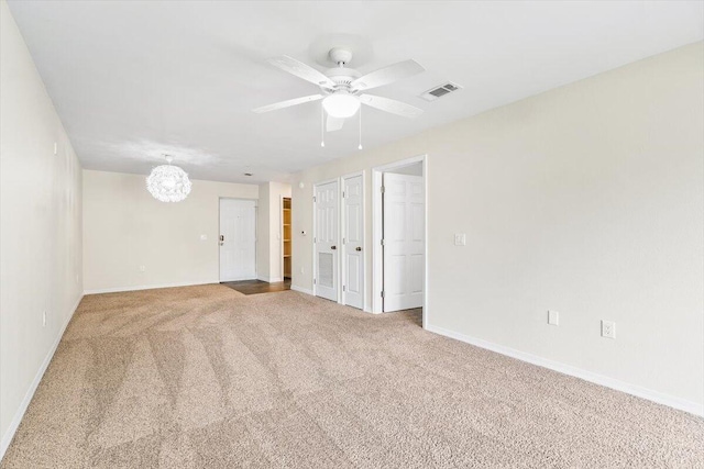 4276 Calinda Ln Apt 138, Niceville, FL 32578 - carpeted empty room with a chandelier and ceiling fan