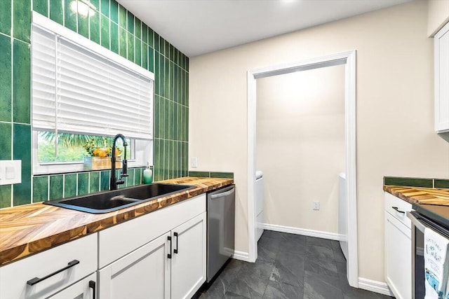 4276 Calinda Ln Apt 138, Niceville, FL 32578 - kitchen with wood counters, appliances with stainless steel finishes, and white cabinets