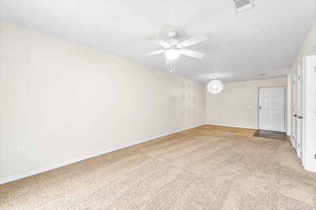 4276 Calinda Ln Apt 138, Niceville, FL 32578 - empty room featuring light carpet, ceiling fan, and a chandelier