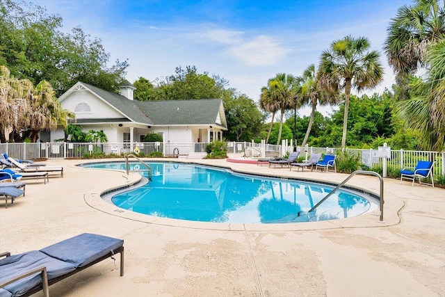 4276 Calinda Ln Apt 138, Niceville, FL 32578 - community pool with a patio and view of wooded area