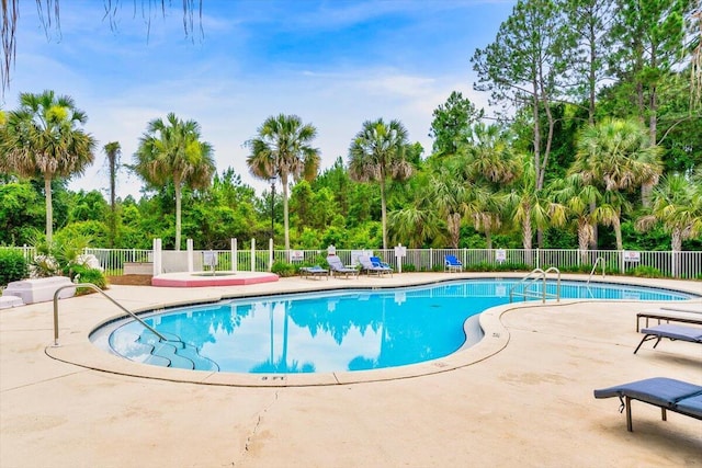 4276 Calinda Ln Apt 138, Niceville, FL 32578 - community pool with view of scattered trees and a patio area