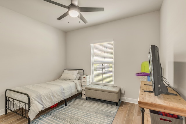 124 Apollo Ave, Freeport, FL 32439 - bedroom with wood finished floors and a ceiling fan