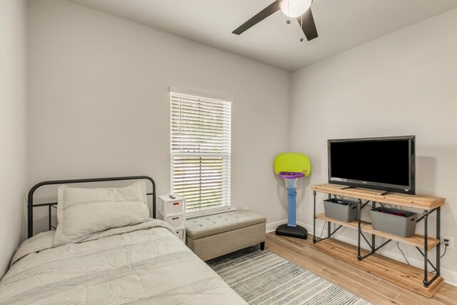 124 Apollo Ave, Freeport, FL 32439 - bedroom featuring wood finished floors and ceiling fan