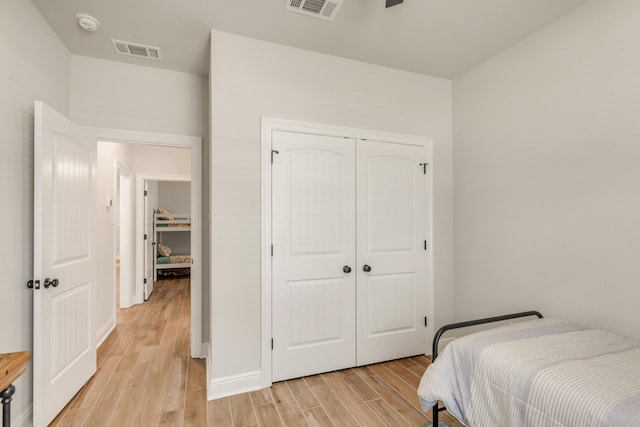 124 Apollo Ave, Freeport, FL 32439 - bedroom featuring light wood-style flooring and a closet