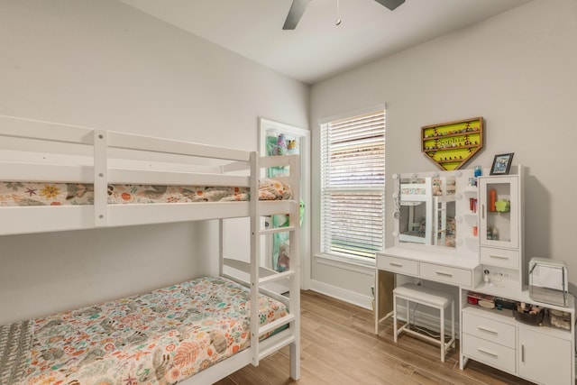 124 Apollo Ave, Freeport, FL 32439 - bedroom featuring multiple windows, light wood-style flooring, and ceiling fan