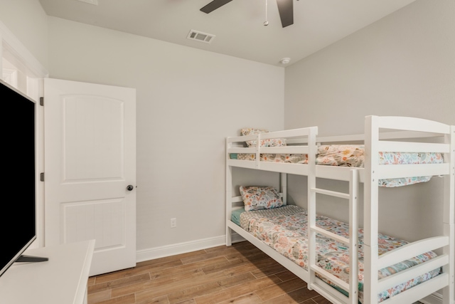 124 Apollo Ave, Freeport, FL 32439 - bedroom featuring wood finished floors and ceiling fan
