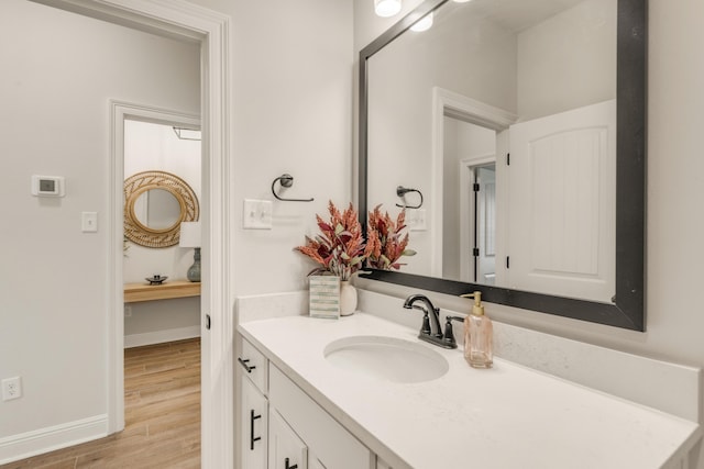 124 Apollo Ave, Freeport, FL 32439 - bathroom with vanity and wood finished floors