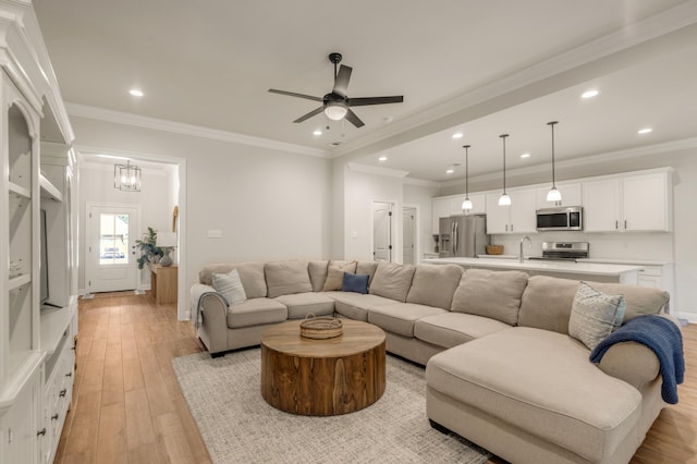 124 Apollo Ave, Freeport, FL 32439 - living room featuring light wood-style floors, ceiling fan, recessed lighting, and ornamental molding