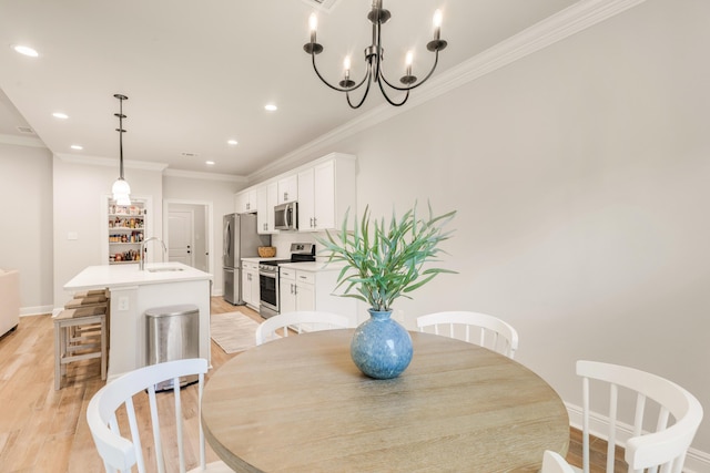 124 Apollo Ave, Freeport, FL 32439 - dining area featuring ornamental molding, light wood-style floors, recessed lighting, and a chandelier