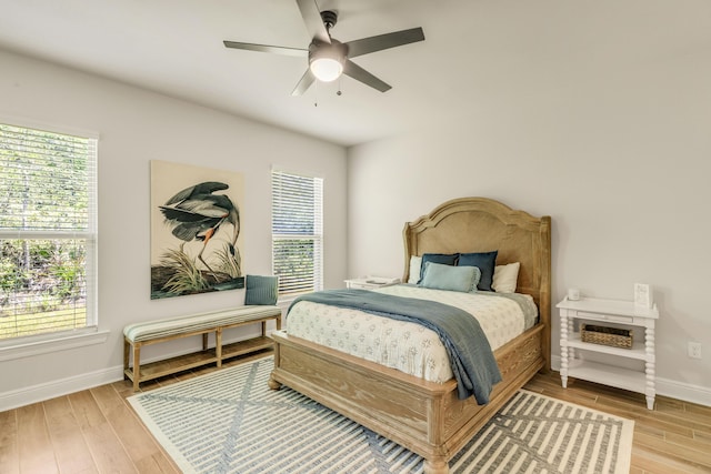 124 Apollo Ave, Freeport, FL 32439 - bedroom with multiple windows and wood finished floors
