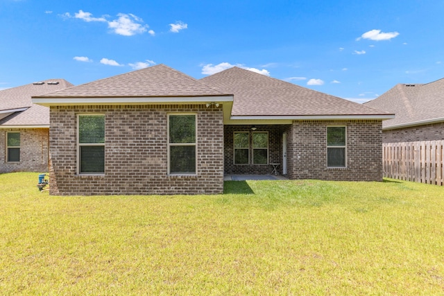 124 Apollo Ave, Freeport, FL 32439 - back of property with brick siding and roof with shingles