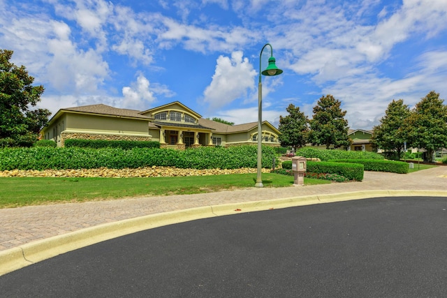 124 Apollo Ave, Freeport, FL 32439 - view of front facade featuring stone siding and stucco siding