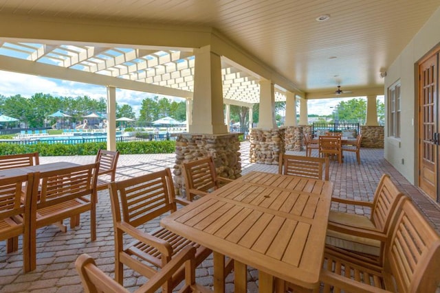 124 Apollo Ave, Freeport, FL 32439 - view of patio / terrace with outdoor dining area, a ceiling fan, and a pergola