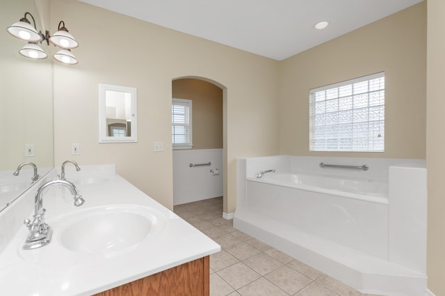 5552 Frontier Dr, Crestview, FL 32536 - bathroom with tile patterned floors, double vanity, and a bath