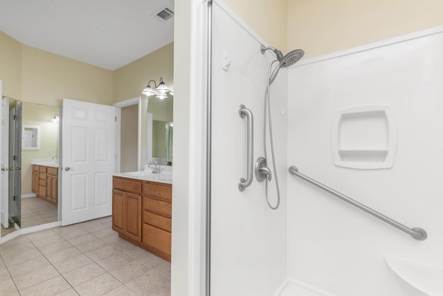 5552 Frontier Dr, Crestview, FL 32536 - full bathroom with vanity, a stall shower, and tile patterned flooring