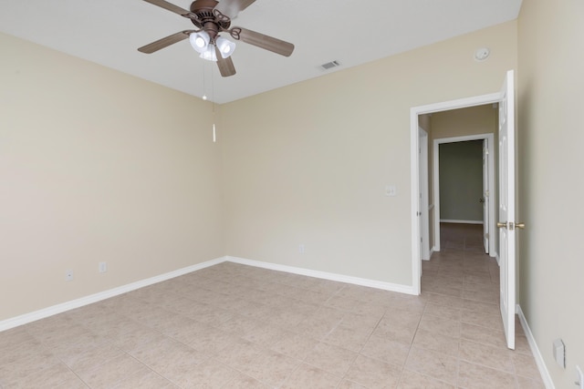5552 Frontier Dr, Crestview, FL 32536 - spare room featuring a ceiling fan, a smoke detector, and light tile patterned floors