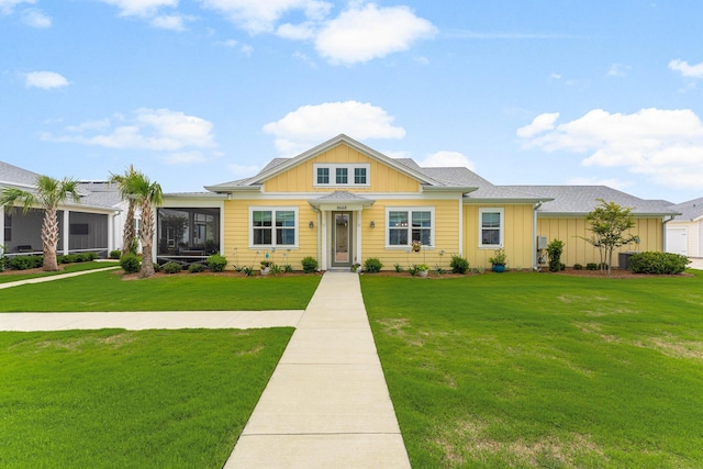 8668 Shell Sink Dr, Panama City Beach, FL 32413 - view of front of property featuring board and batten siding and a front yard