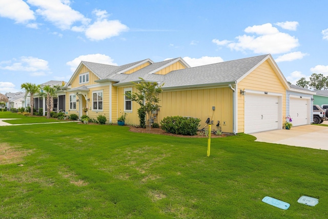 8668 Shell Sink Dr, Panama City Beach, FL 32413 - view of front of property with board and batten siding, a garage, driveway, a front yard, and a shingled roof