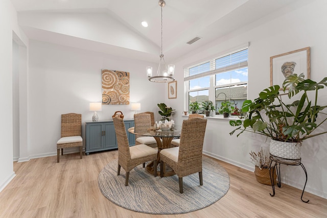 8668 Shell Sink Dr, Panama City Beach, FL 32413 - dining space with a chandelier, light wood finished floors, vaulted ceiling, and recessed lighting