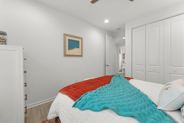 8668 Shell Sink Dr, Panama City Beach, FL 32413 - bedroom with wood finished floors, a closet, recessed lighting, and a ceiling fan