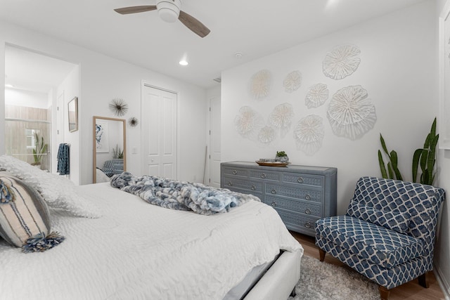 8668 Shell Sink Dr, Panama City Beach, FL 32413 - bedroom with wood finished floors, a closet, a ceiling fan, and recessed lighting
