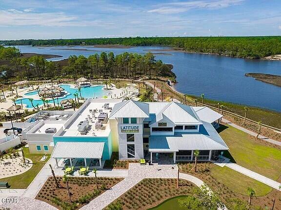 8668 Shell Sink Dr, Panama City Beach, FL 32413 - bird's eye view of a pool and a nearby body of water