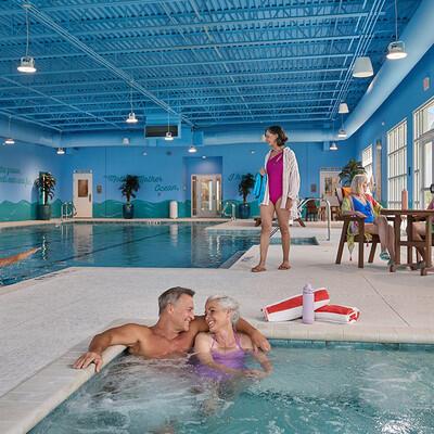 8668 Shell Sink Dr, Panama City Beach, FL 32413 - indoor community pool with a patio and french doors