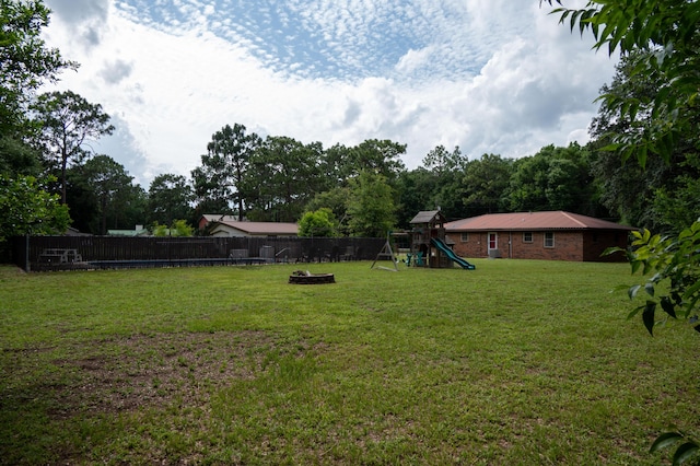 3180 Palmetta Ave, Crestview, FL 32539 - fenced backyard with a playground
